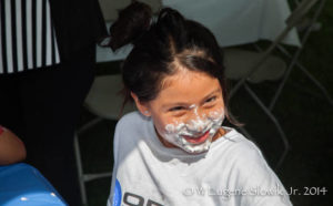 Orion employee's daughter with pie on her face