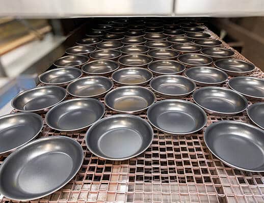 Orion-cookware-on-conveyor