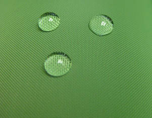 Water droplets on green fabric
